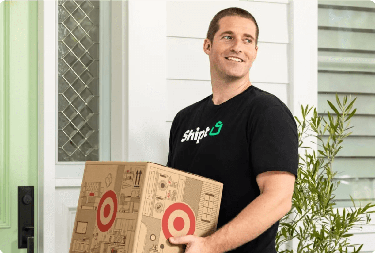 Shipt package delivery person at front doorstep with Target delivery box